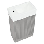Petit meuble-lavabo de salle de bain avec évier en céramique et étagères ouvertes