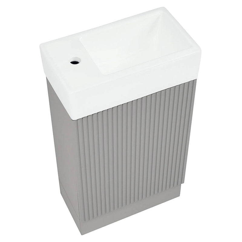Petit meuble-lavabo de salle de bain avec évier en céramique et étagères ouvertes